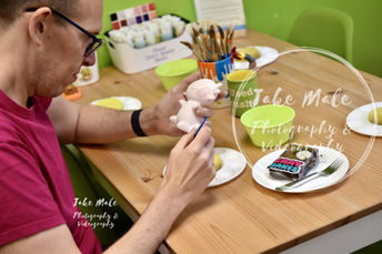 Cray Bakes owner painting a pot
