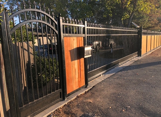 Custom iron fence with wood stain