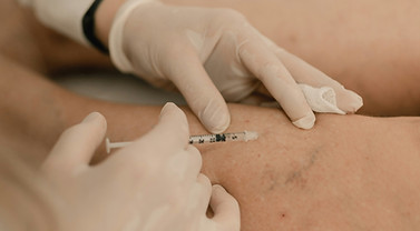 A woman getting her arm examined by a doctor_edited.jpg