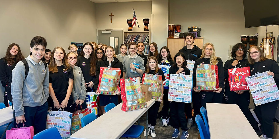Students in the Community Service Club after wrapping up their "Birthday in a Bag" project.