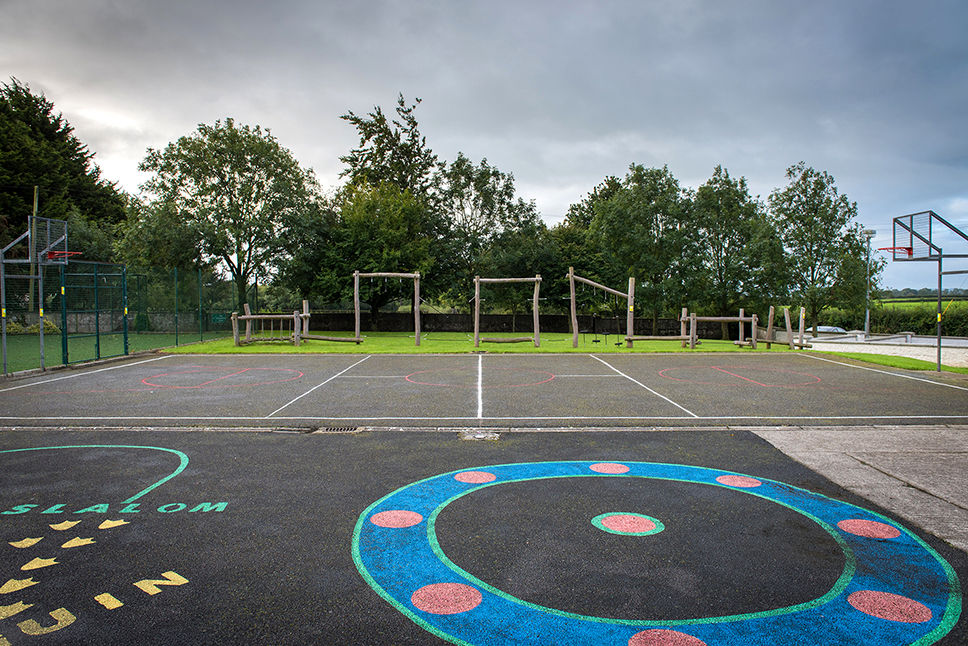 Outdoor school playground: basketball court, fitness area