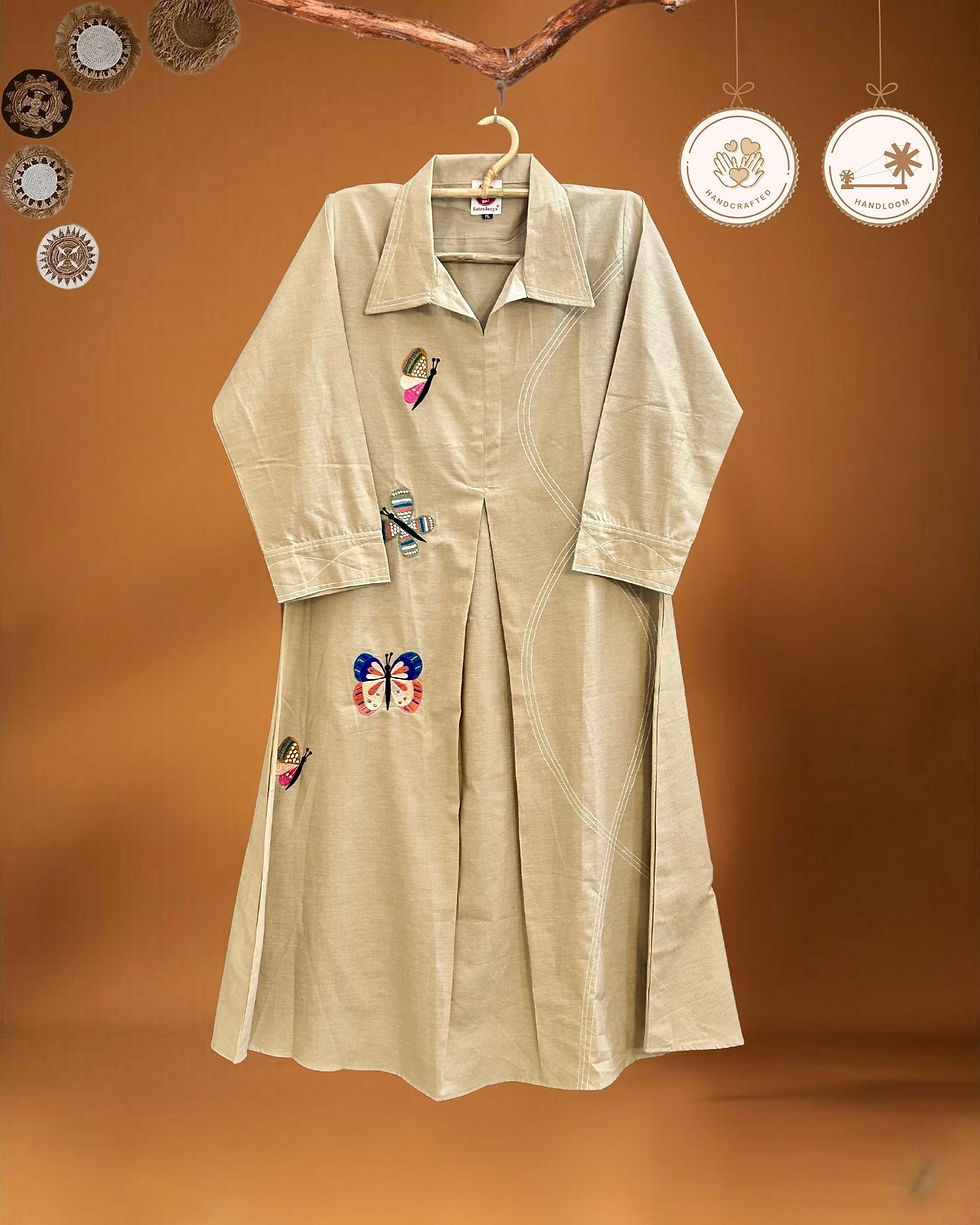 Thumbnail: Sandstone beige handloom cotton dress with butterfly embroidery and box pleats – hanger view by Sutralasya