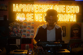 These images capture the vibrant essence of Miami’s rising house-music scene, showcasing a diverse lineup of DJs performing live at Electrodade’s signature events. Shot inside intimate, neon-lit venues like Temple Miami and underground Wynwood bars, each photo reflects the raw energy, creativity, and community that define Electrodade. From hypnotic deep-house grooves to percussive tech-house drops, the DJs featured here — both emerging artists and established selectors — command the room with precision, passion, and unmistakable Miami style. Warm red and amber lighting highlight the atmosphere, while Pioneer DJ gear, glowing LED signage, and expressive crowd moments frame each performance as a unique artistic experience. Electrodade’s visual identity shines through every shot: cinematic lighting, immersive sound, and an inclusive platform that gives local DJs the spotlight they deserve. These images represent what the brand stands for — high-quality music curation, authentic electronic culture, and unforgettable nights powered by community. Whether it’s a packed room moving to soulful house rhythms or a DJ locked in behind the decks shaping the next drop, Electrodade brings Miami a modern, underground spirit that blends innovation, artistry, and passion for electronic music.