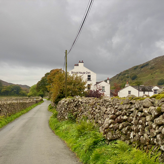 pub and dry stone wall in lake district eskdale
