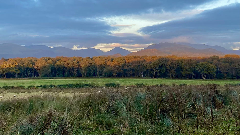 Landscape view over the lakeland fells at sunset