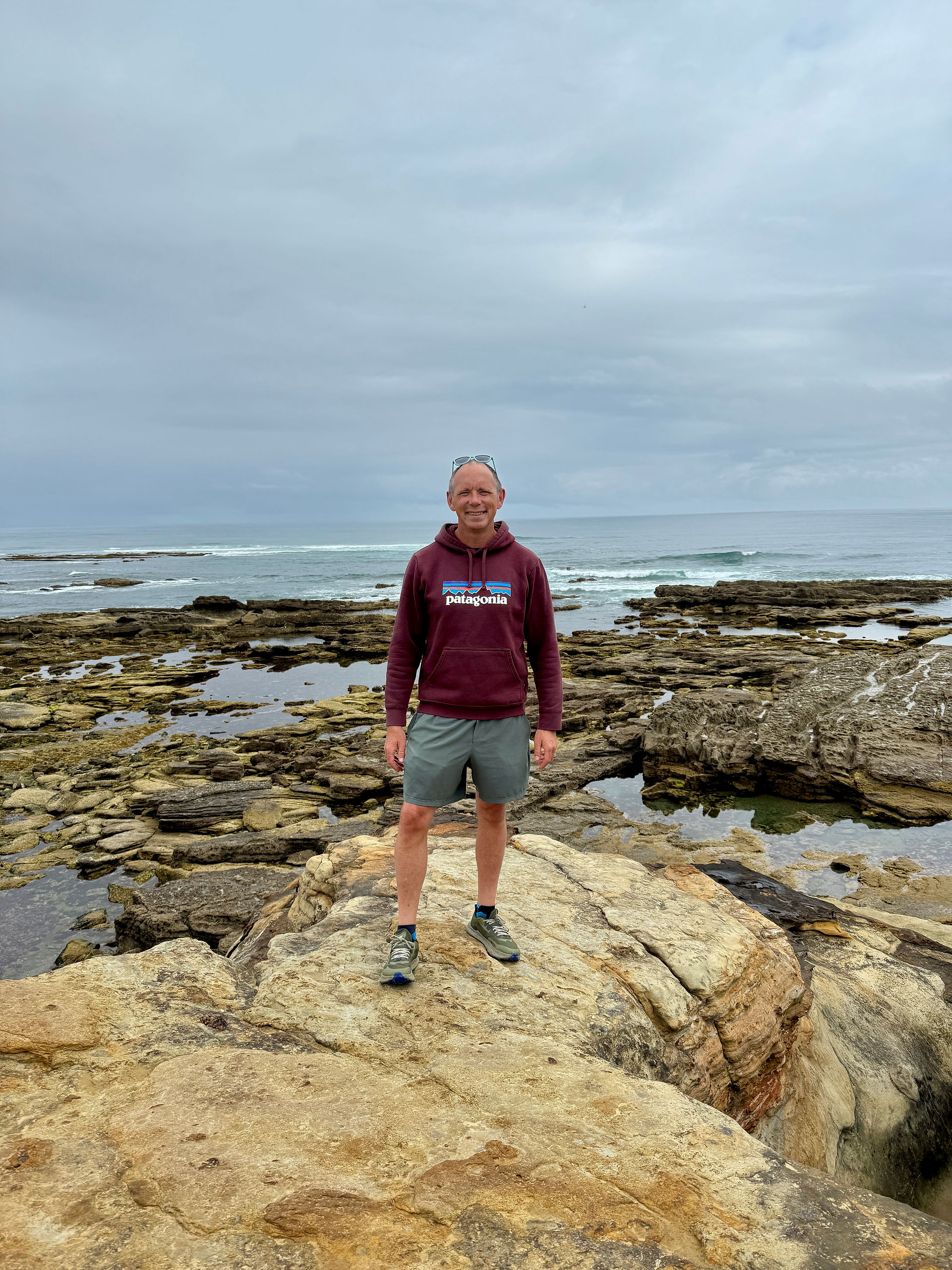 man with sea in background 