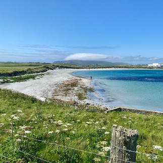 white sand beach on shetland islands 