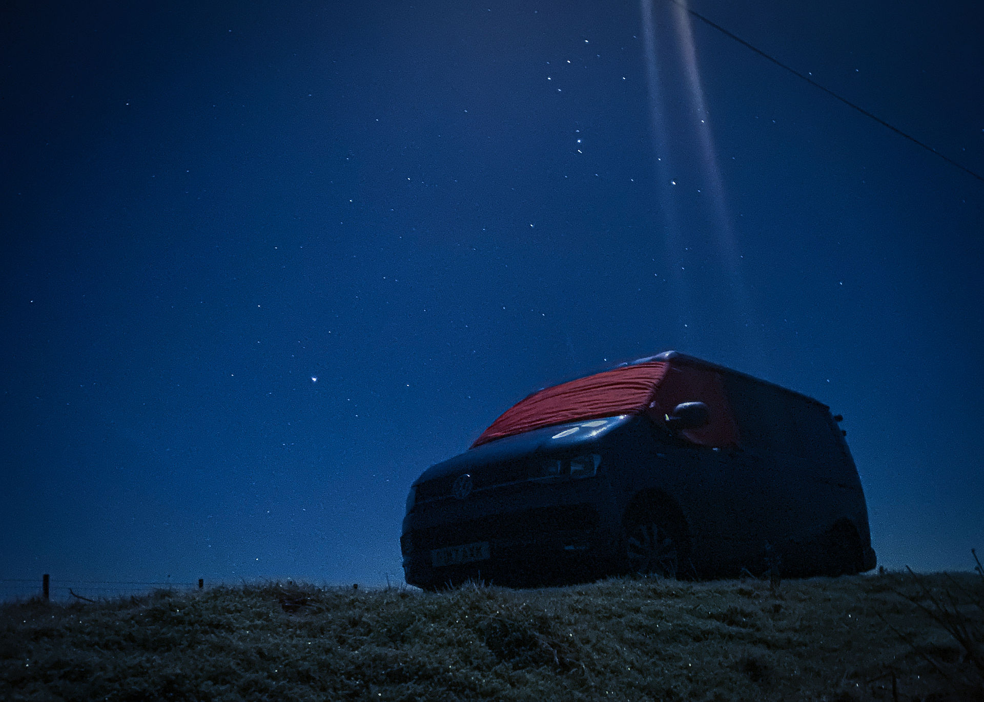 VW campervan under starlit skies