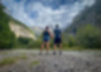 Couple looking up at mountain landscape