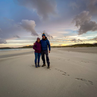 couple sunset photo on reef beach