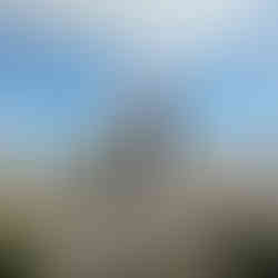man next to trig point