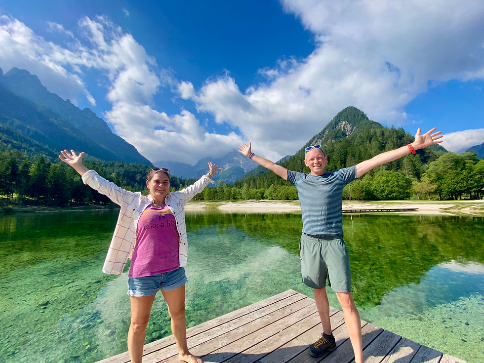 couple photo by a lake in the mountains