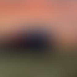 VW campervan under sunrise skies