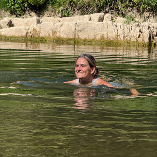 woman wild swimming in the river