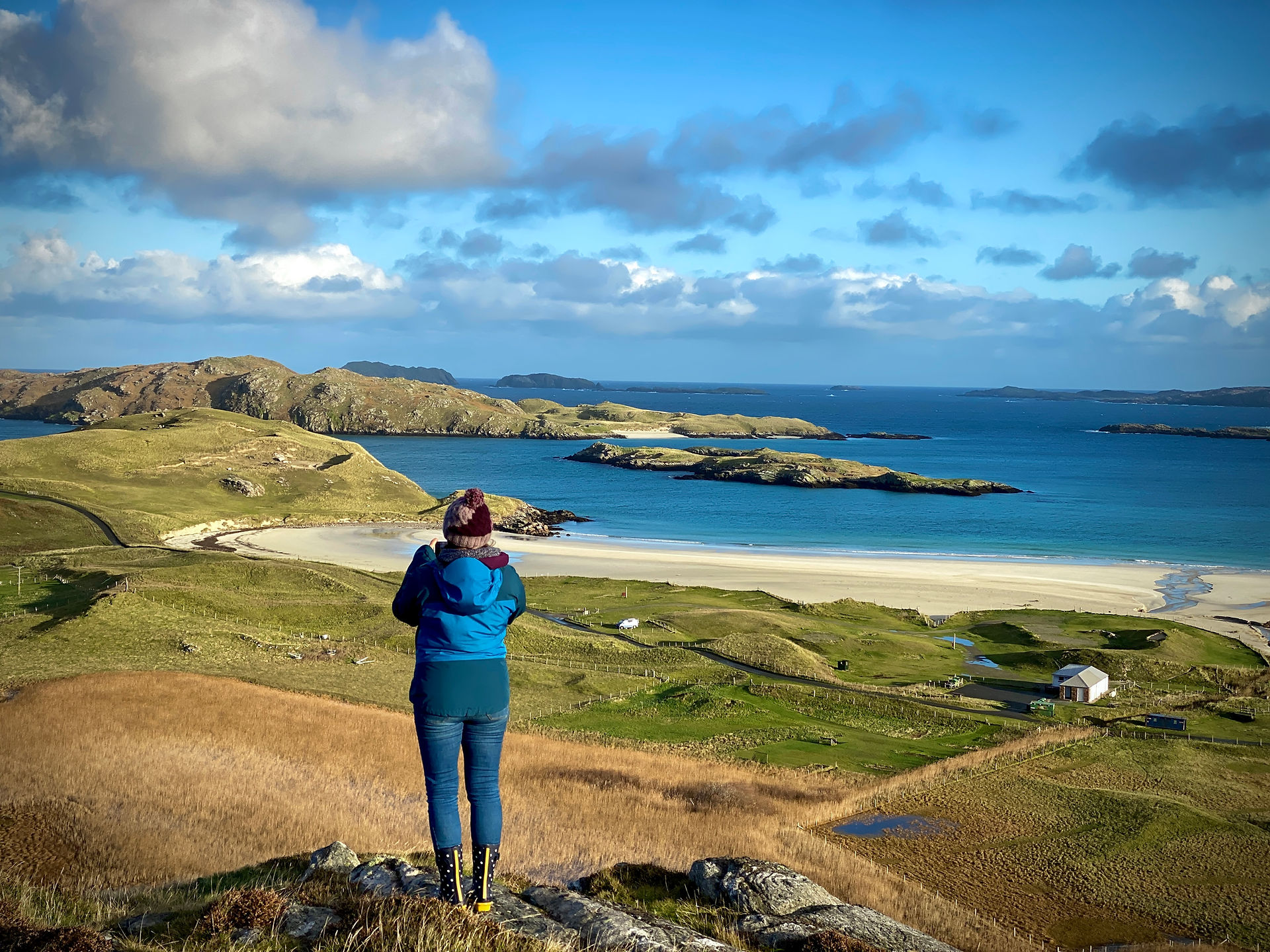 woman looking at the view over reef beach on lewis