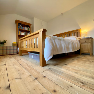 cottage bedroom with wooden floor