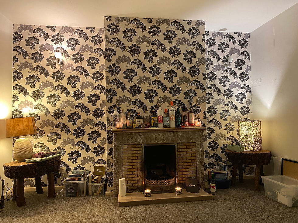 lounge and fireplace in need of modernisation