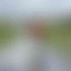 man and reflection in puddle 