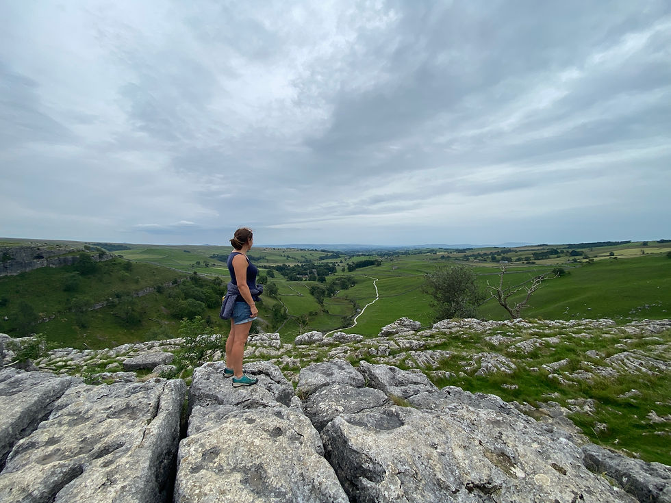 woman on Malham cove limestone paving