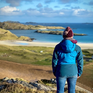 woman looking at view over reef beach on Isle of Lewis