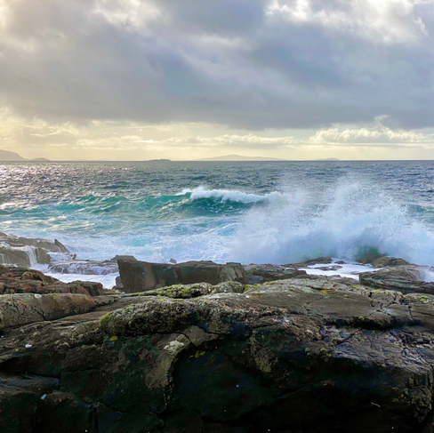 wave crashing against rocks
