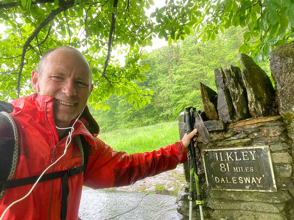 man next to Dales way end sign