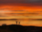 couple silhouetted at sunset