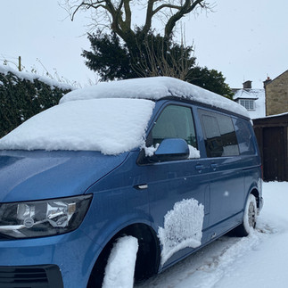 VW van covered in snow 