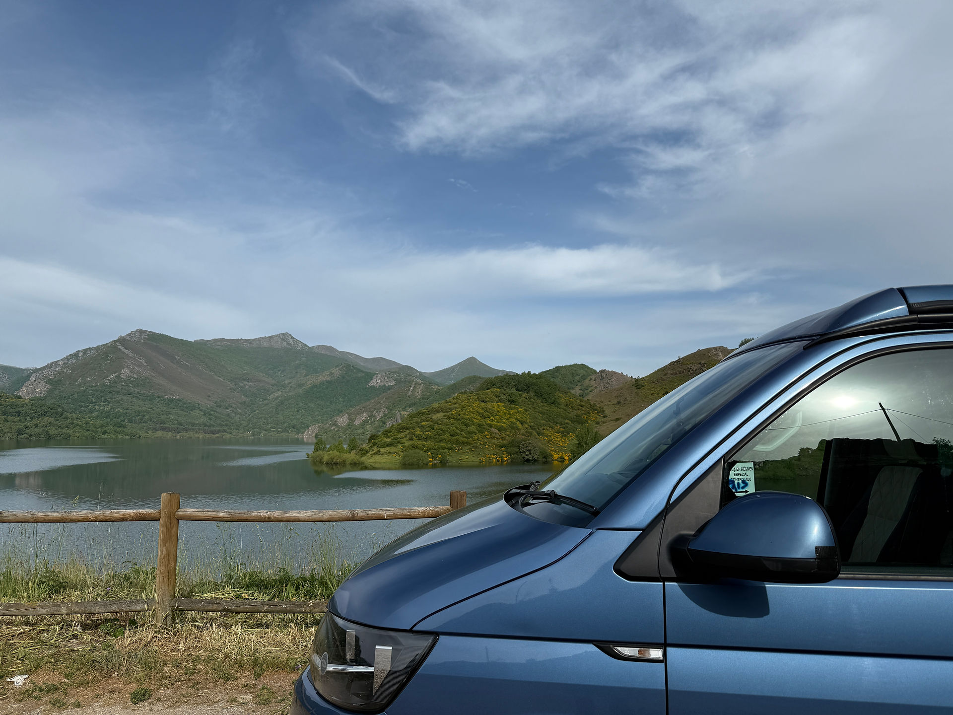 VW camper by a lake 