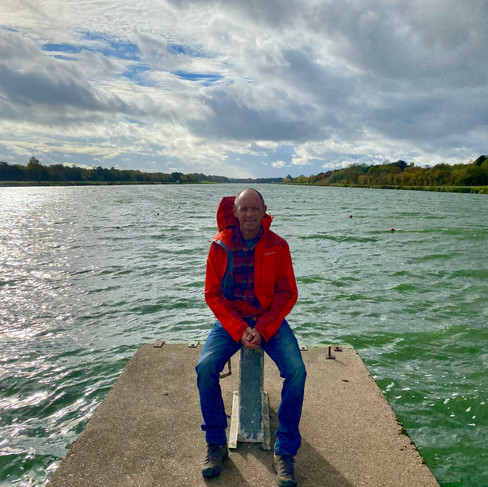 man sitting on rowing starting blocks at Holme Pierrepont UK