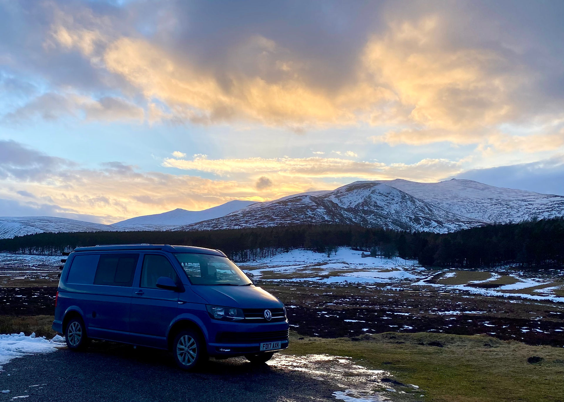VW van with snowy mountain in the background