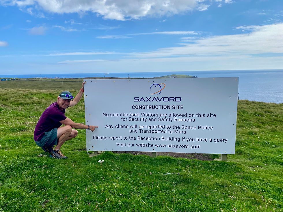 man at saxovord sign