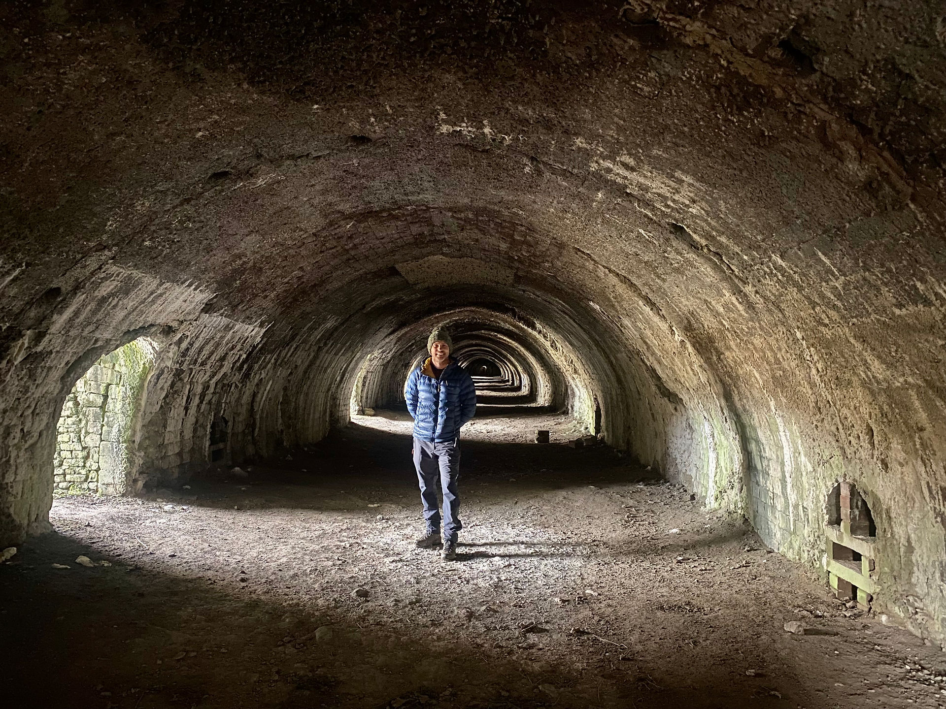 man in dark lime kiln