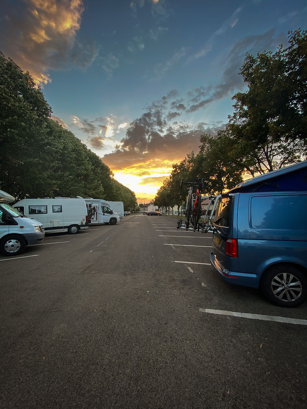 VW campervan at sunset in a French Aire