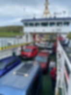 vehicles on a ferry to Hoy