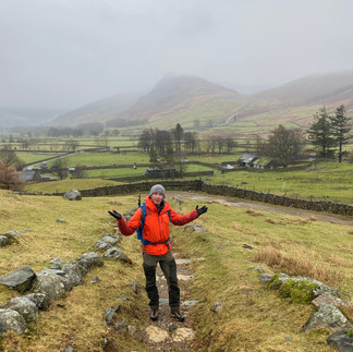 man on a path in the lakes 