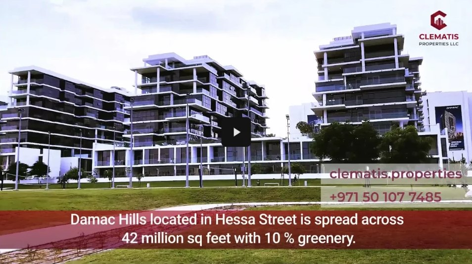 Damac Hills residential buildings with a lawn in front