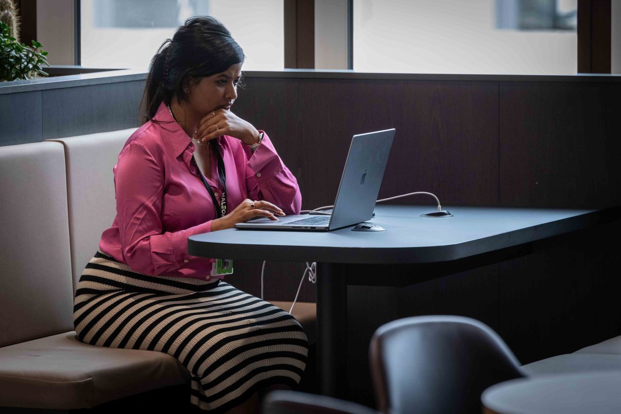 Working at a laptop in the Haleon office during the event week