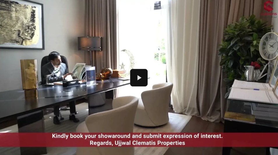 Warmly lit executive office with a presenter at the desk