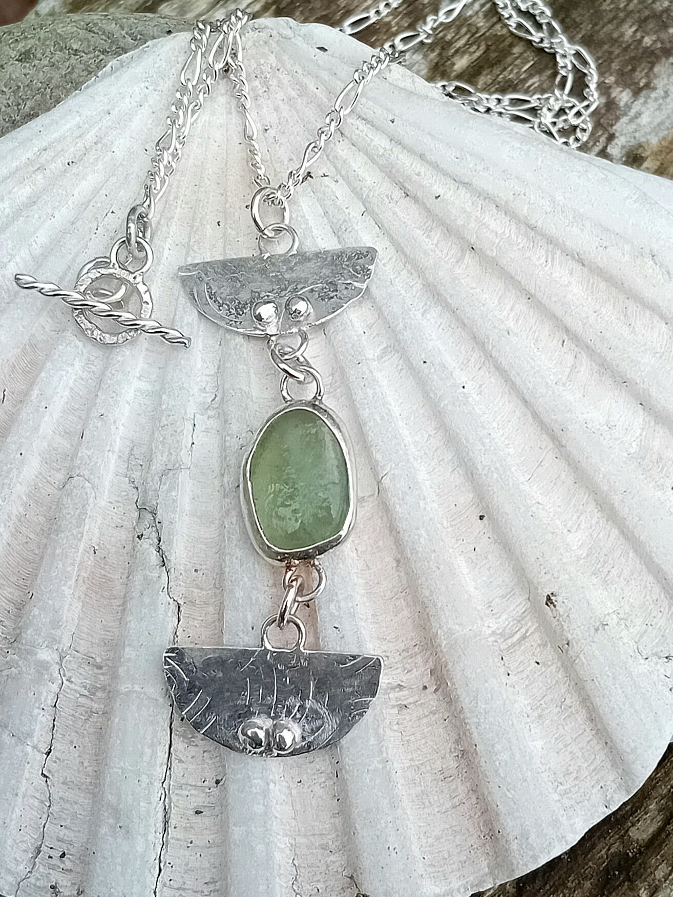Green sea glass half moon pendant
