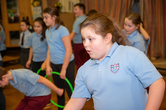 Year 5 students play with hoops at school in Beaufort Hill.