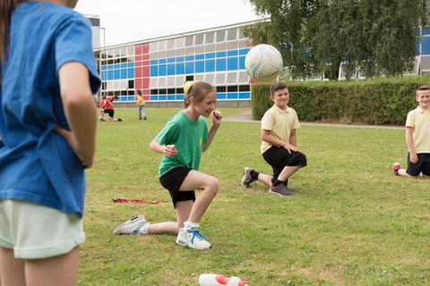Children playing ball game at miltonprimaryschool