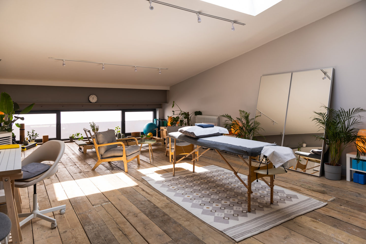 Private treatment room for hire in Hackney, fully equipped with a professional massage table and storage