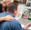 photodune-268312-couple-in-kitchen-using-laptop-real-estate-xs.jpg