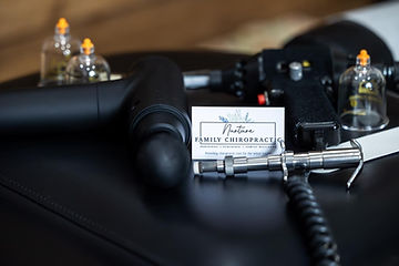 Chiropractic adjusting tools, massage gun, and cupping equipment