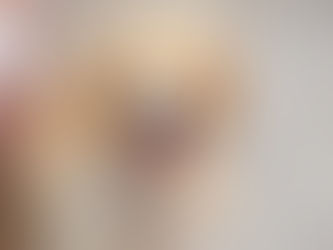 A dog sits on the floor of a vet hospital after being treated for a wasp sting.