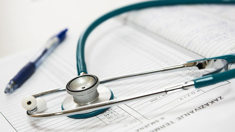 Stethoscope and pen on patient chart