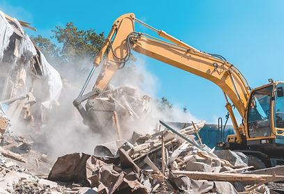 Demolition building. Excavator destroy old house.jpg