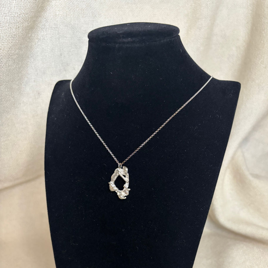 Grove unique molten silver pendant on black bust