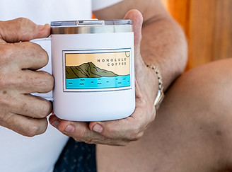 Guy holding a vida mia coffee cup